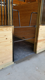 Rubber stall mat installed in a box stall